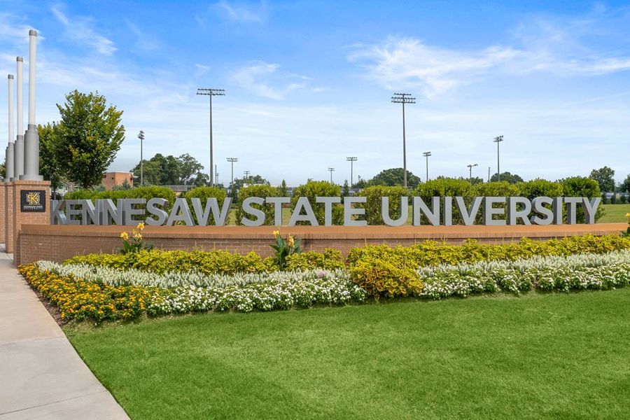 Entrance to the Devin's Shire community in Kennesaw, GA, featuring signage and landscaping (Image 2).