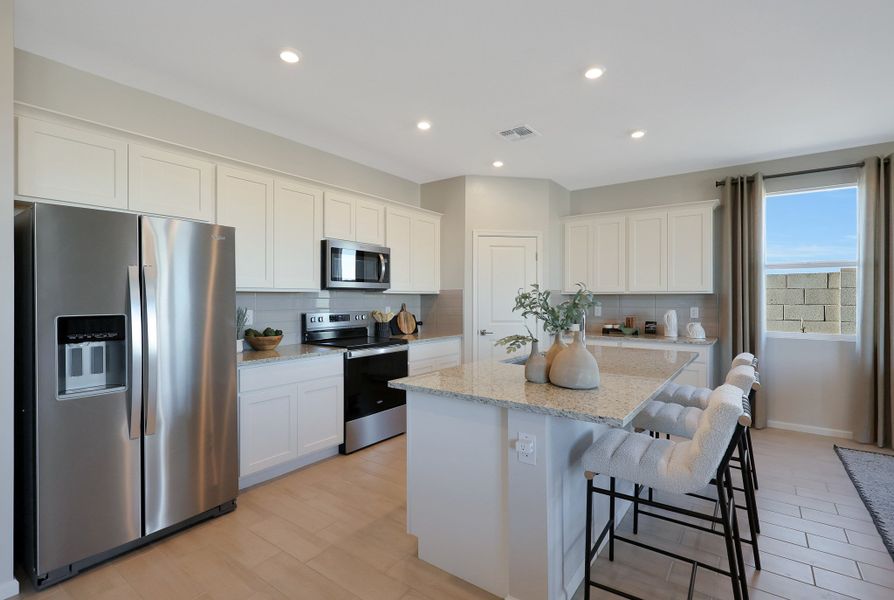A kitchen with white cabinets. A kitchen with white cabinets.