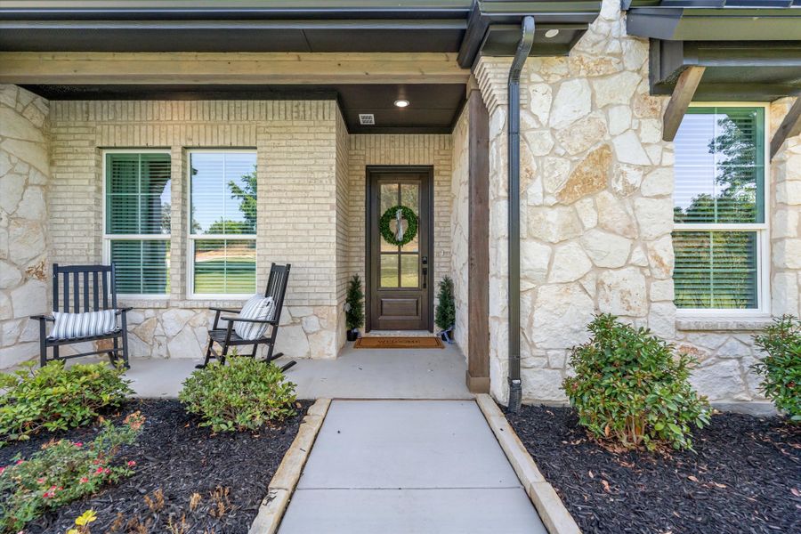 Front exterior of a home in the Oak Grove Addition community, located in Springtown, TX (Image 12).