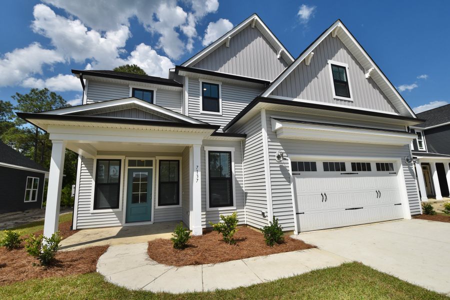 Front exterior of a home in the The Bluffs at Lake Waccamaw community, located in Lake Waccamaw, NC (Image 3).