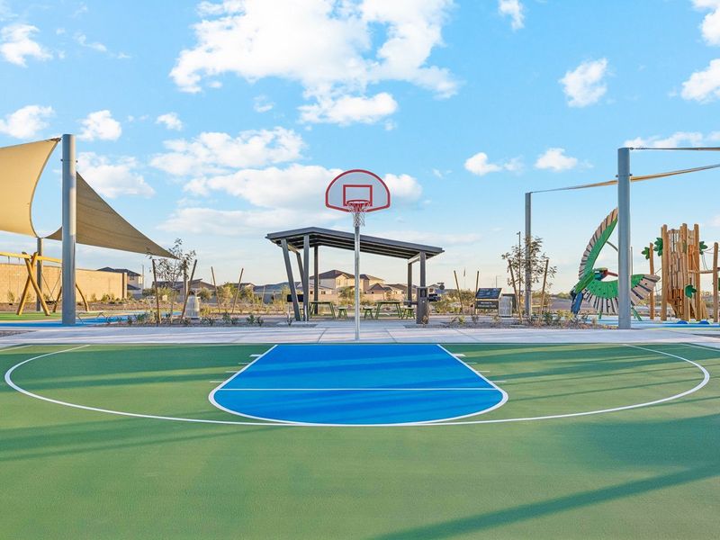 A basketball court with a basketball hoop. A basketball court with a basketball hoop.