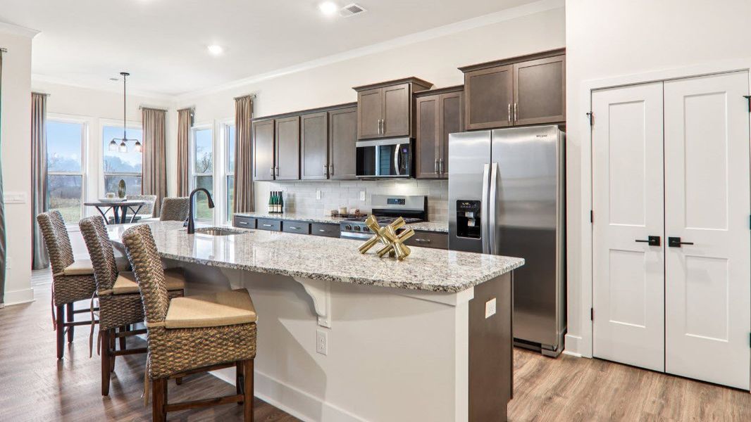 Furnished interior in a model home at Reserve at Tap Root Farms in Fletcher (Image 17).