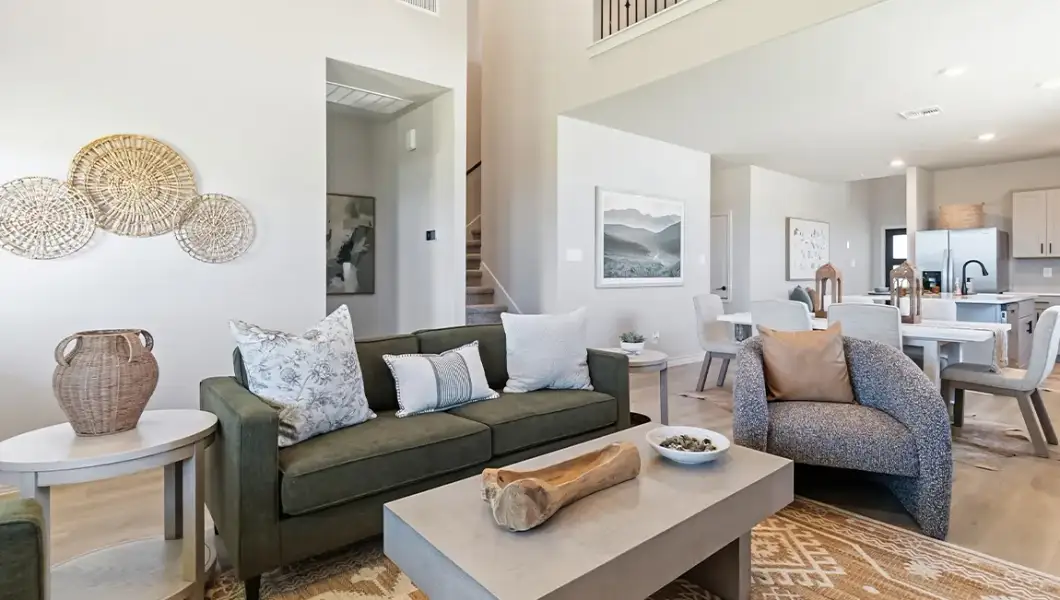 Furnished interior in a model home at The Woodlands at Medina Hills in Mico (Image 33).
