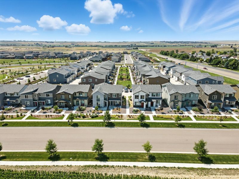 Aerial view of the Pintail Commons at Johnstown Village community in Johnstown, CO, showing layout and nearby surroundings (Image 10). Aerial view of the Pintail Commons at Johnstown Village community in Johnstown, CO, showing layout and nearby surroundings (Image 10).