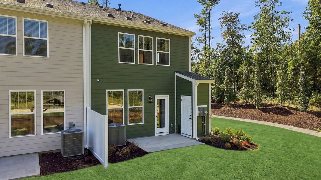Elegant rear exterior with a private patio—perfect for relaxing or entertaining outdoors at Brookland Place