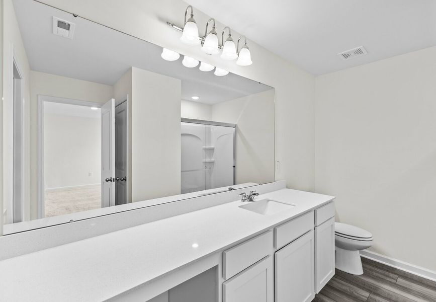 Furnished interior in a model home at The Summit at Carters Station in Columbia (Image 17).