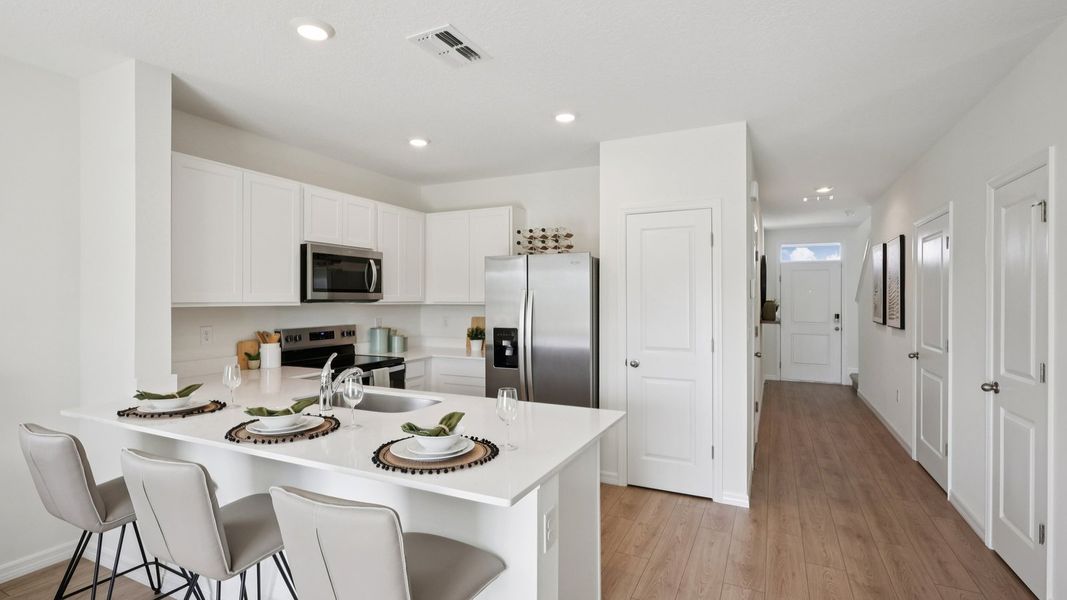 Furnished interior in a model home at Towns at Woodsdale in Wesley Chapel (Image 6).