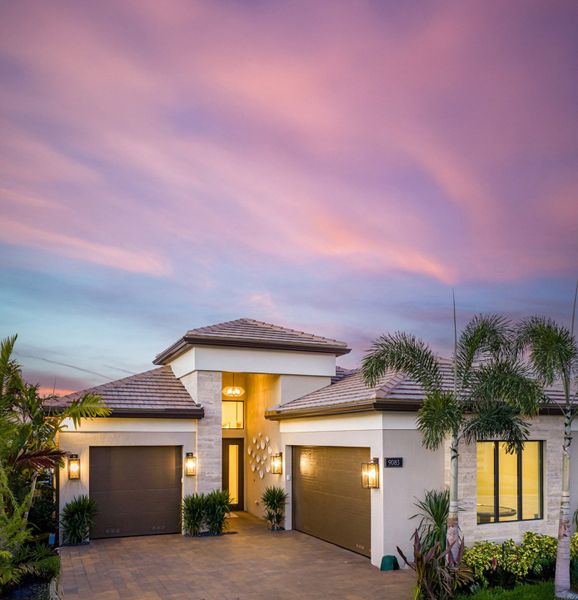 Front exterior of a home in the Valencia Grand (55+) community, located in Boynton Beach, FL (Image 4).