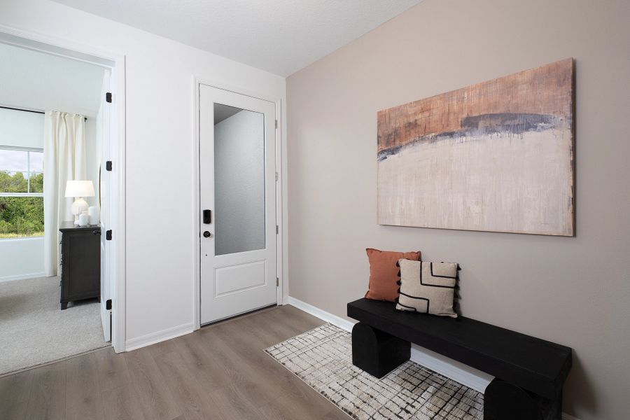 Furnished interior in a model home at Hawks Run in Kissimmee (Image 10).