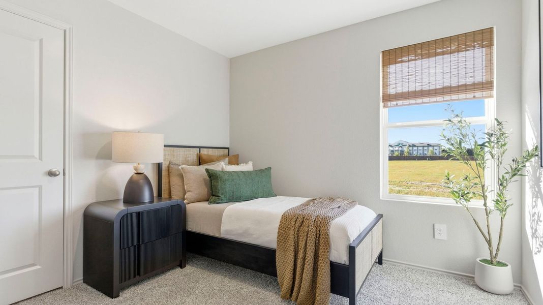 Furnished interior in a model home at Watermark in Alvin (Image 20).