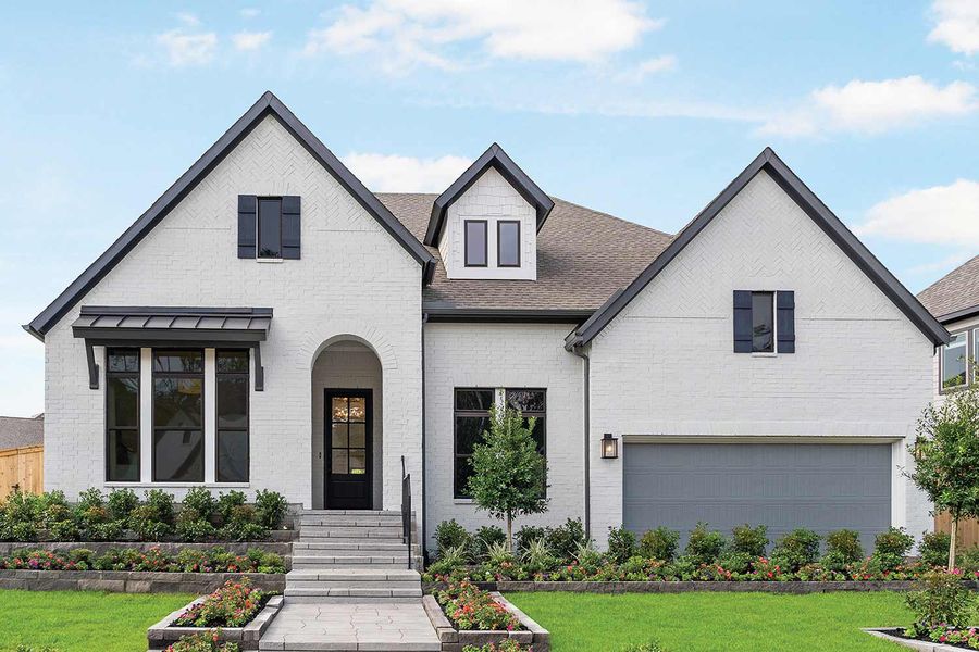 Front exterior of a home in the The Woodlands Hills 60’ community, located in Willis, TX (Image 3). Front exterior of a home in the The Woodlands Hills 60’ community, located in Willis, TX (Image 3).
