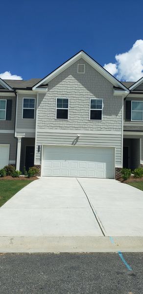 A charming grey townhouse with a two-car garage in Sandtown Falls by Rockhaven Homes, Atlanta, GA. A charming grey townhouse with a two-car garage in Sandtown Falls by Rockhaven Homes, Atlanta, GA.
