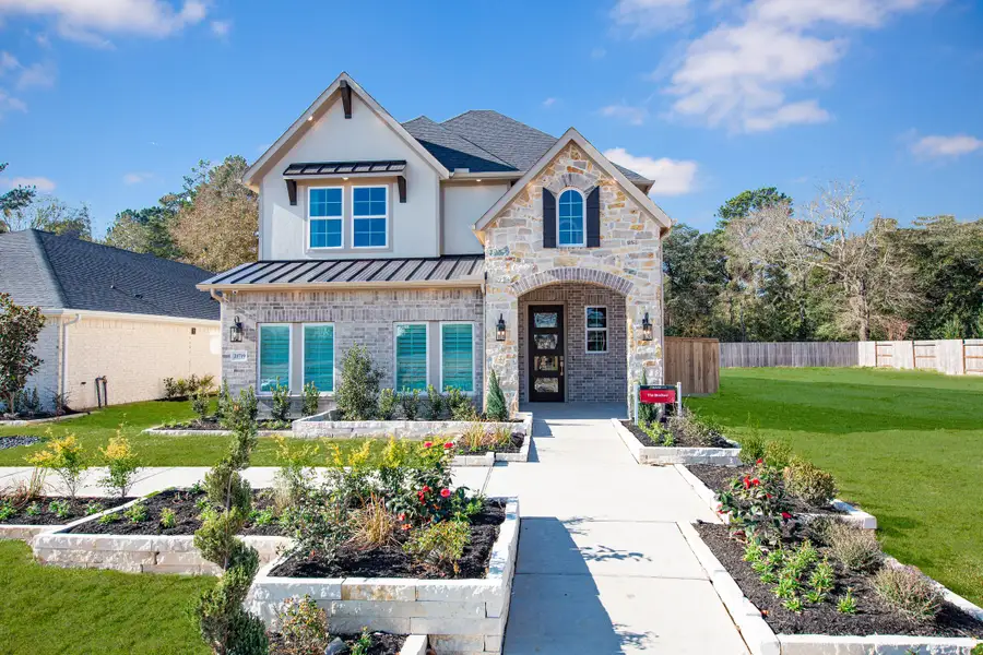 Front exterior of a home in the Arcadian Estates community, located in Pearland, TX (Image 9).