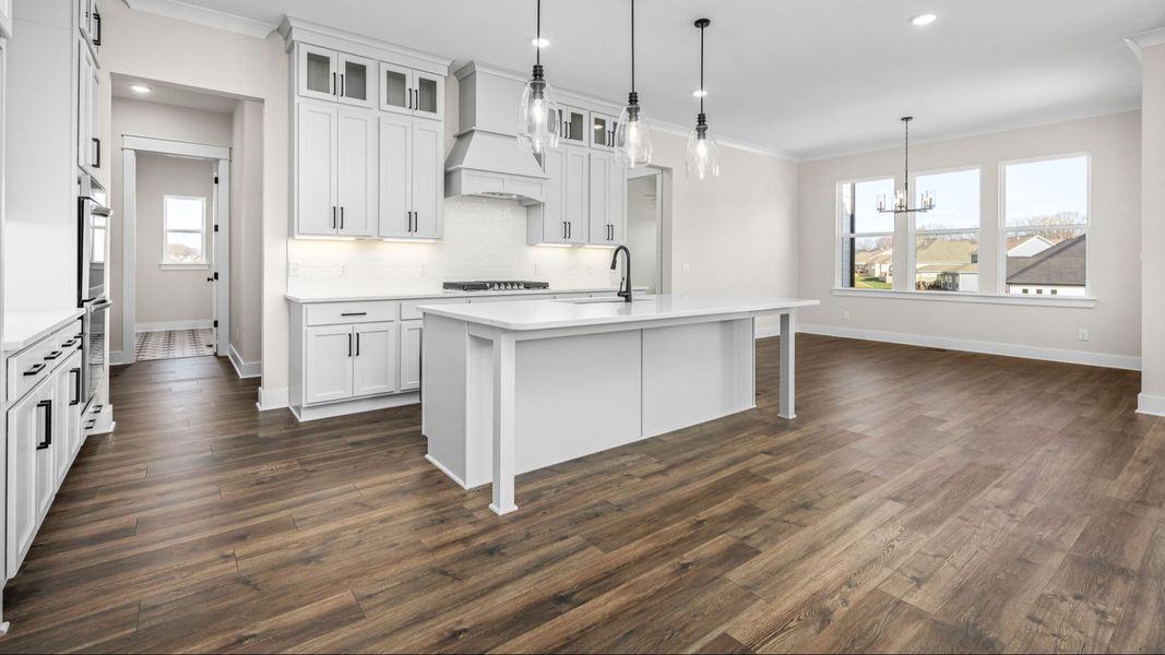 Kitchen and dining area with hard surface flooring and naturally bright from windows Kitchen and dining area with hard surface flooring and naturally bright from windows