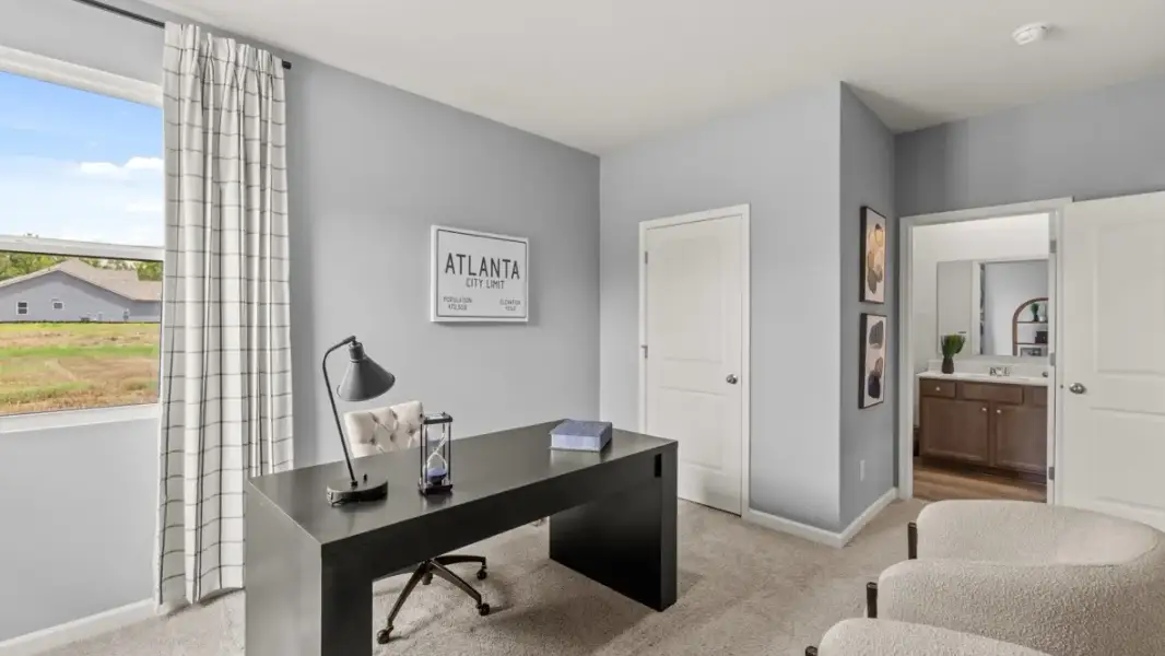 Furnished interior in a model home at Enclave at Stonewall Tell in South Fulton (Image 11).