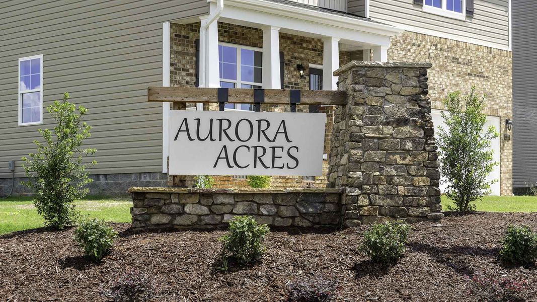 Entrance to the Aurora Acres community in Snow Camp, NC, featuring signage and landscaping (Image 2).