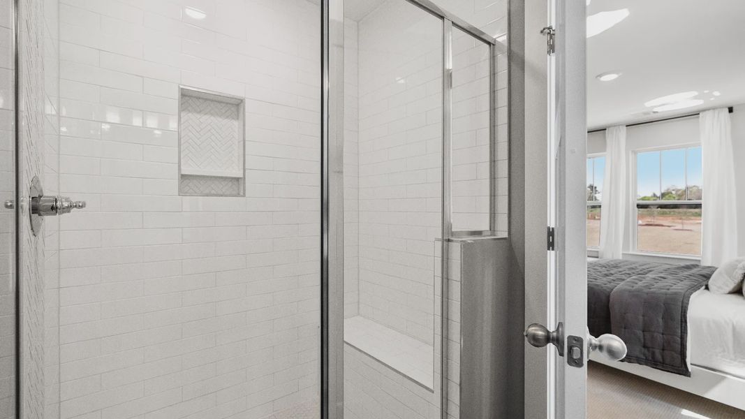 DRB Homes modern two story townhome at Clayton Crossing by DRB Homes in Arden, NC with bright white tiled shower DRB Homes modern two story townhome at Clayton Crossing by DRB Homes in Arden, NC with bright white tiled shower