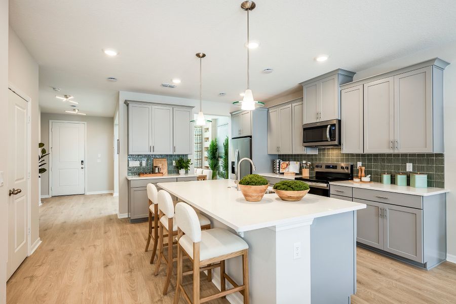 Furnished interior in a model home at Aulin Square in Oviedo (Image 9).