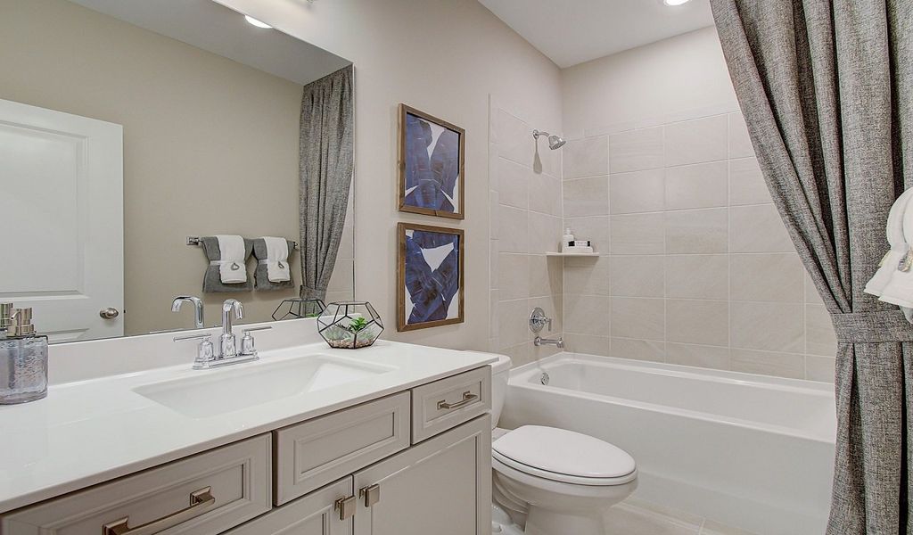 Lower-level full bedroom and bathroom make a perfect guest suite.