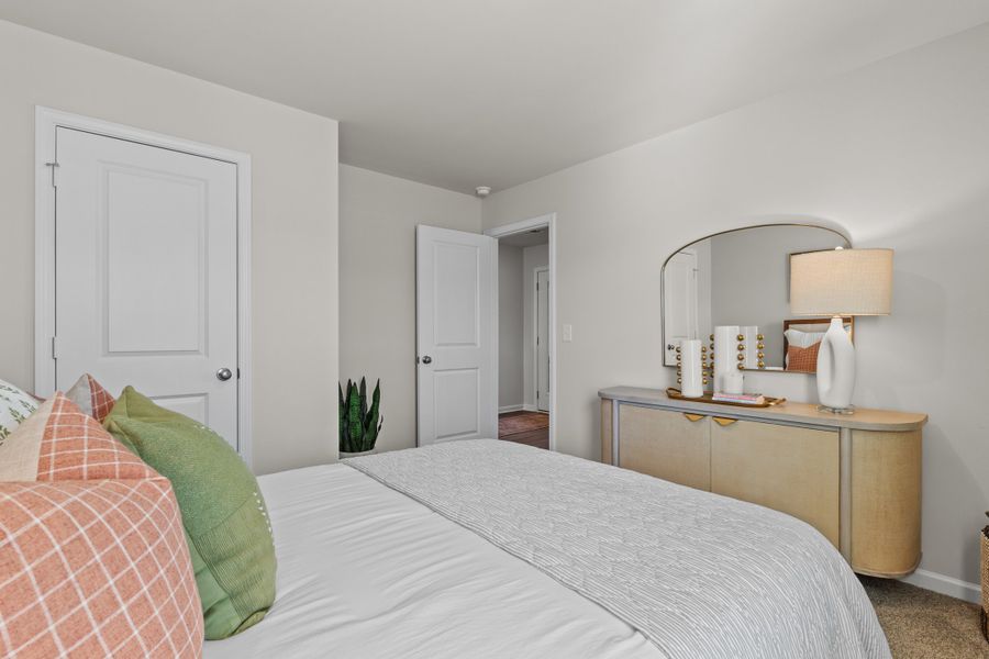 Furnished interior in a model home at Canary Woods in Hopkins (Image 20).