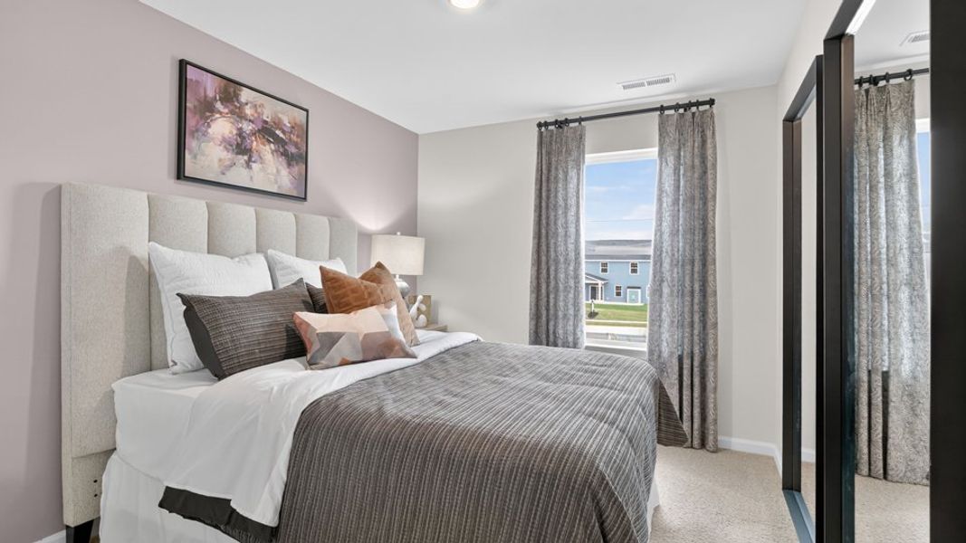 Furnished interior in a model home at The Townes at Belle Grove in Wendell (Image 36).