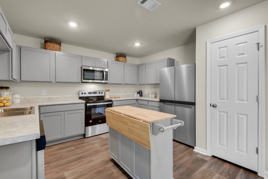 Furnished interior in a model home at Floridatown in Pace (Image 4).