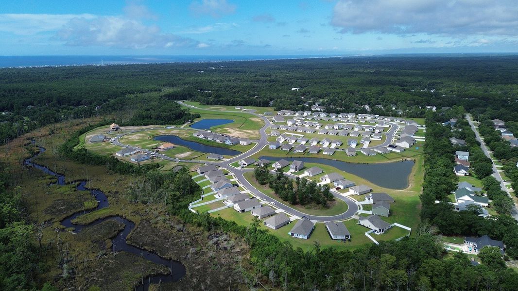Aerial view of the Stanbury Creek community in Supply, NC, showing layout and nearby surroundings (Image 10). Aerial view of the Stanbury Creek community in Supply, NC, showing layout and nearby surroundings (Image 10).