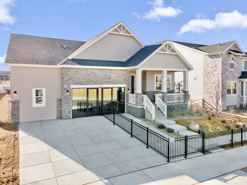 Front exterior of a home in the The Estates Collection at Murphy Creek community, located in Aurora, CO (Image 10).