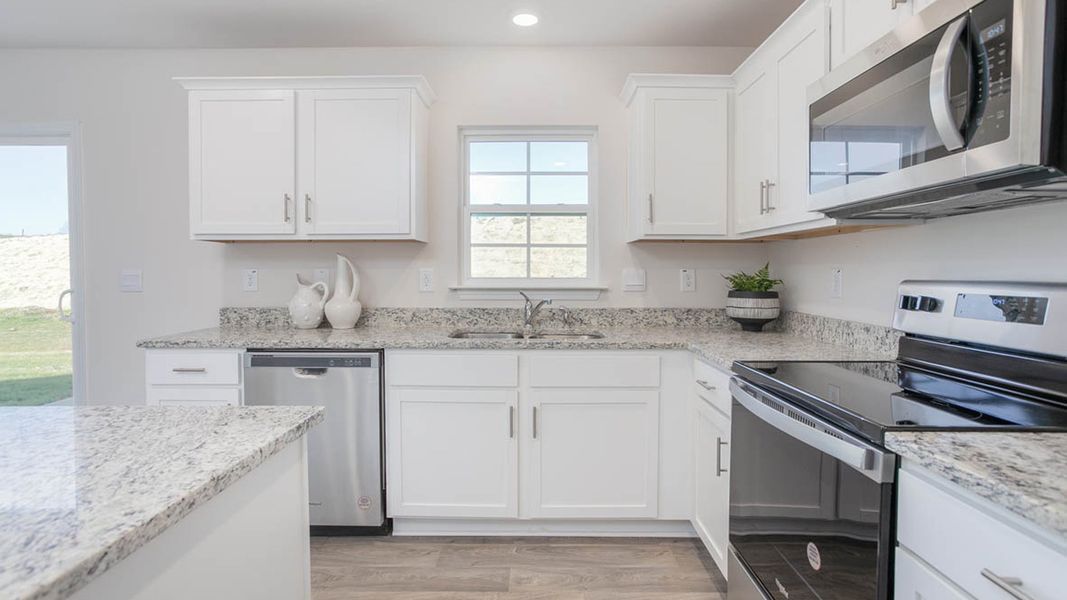 Furnished interior in a model home at Preston Oaks in King (Image 20).