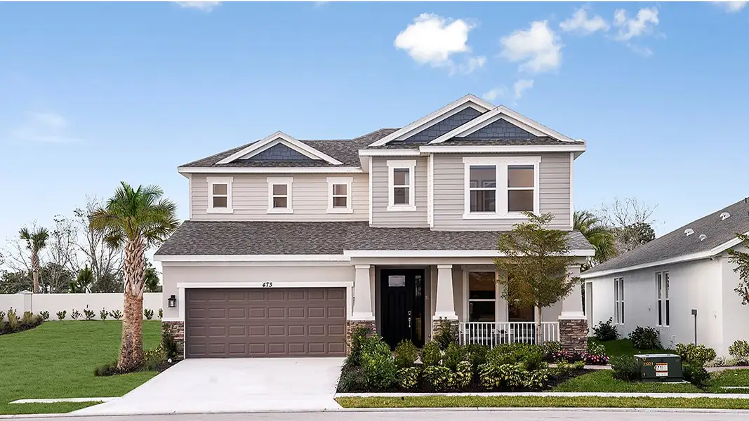 Front exterior of a home in the Veranda Oaks community, located in Port St. Lucie, FL (Image 2).
