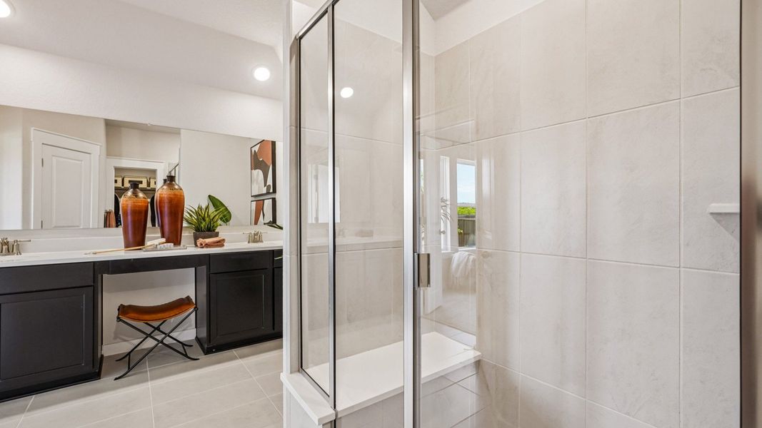 Framed Glass Shower complete with marble shower seat.
