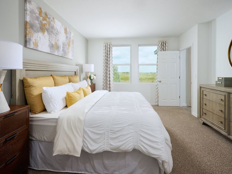 Primary bedroom in the Yellowstone floorplan modeled at Springs at Lake Alfred