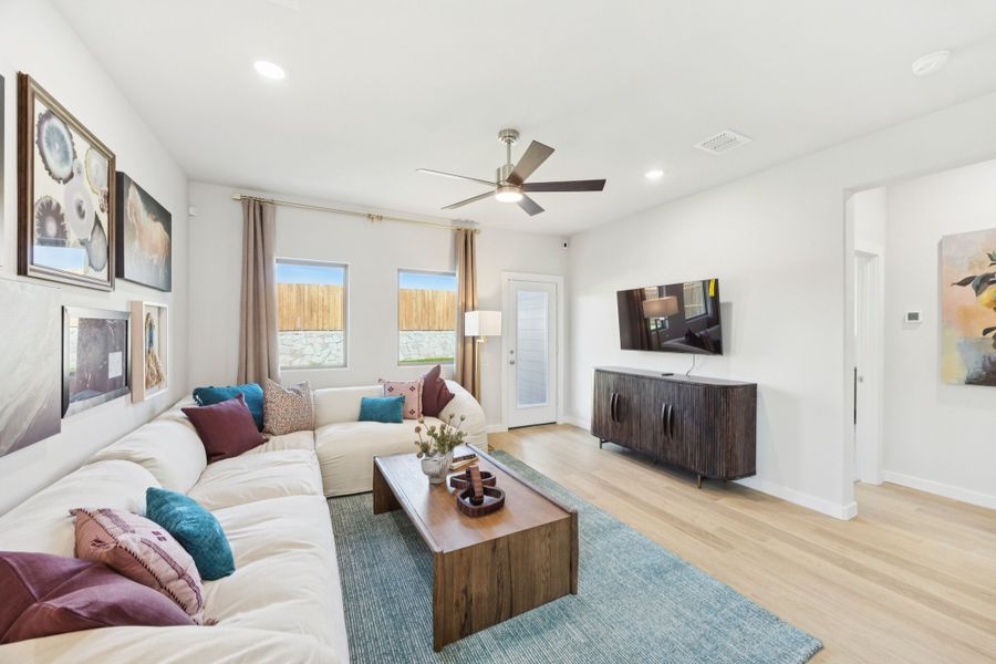 Living Room in a Belmont Magnolia Model Home in Aubrey TX by Trophy Signature Homes Living Room in a Belmont Magnolia Model Home in Aubrey TX by Trophy Signature Homes