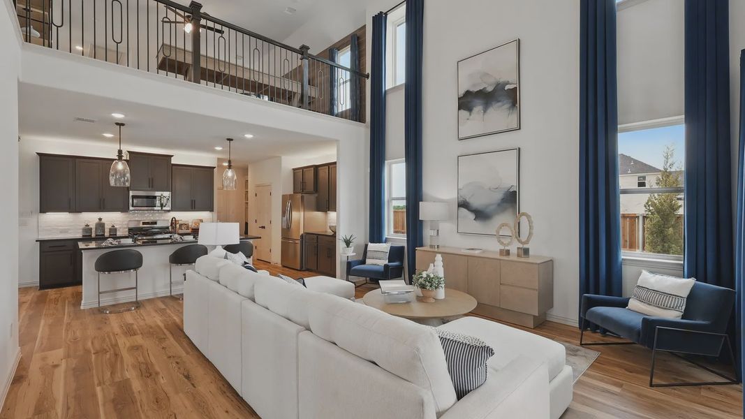 Experience luxury with soaring ceilings, refined wood floors, and elegant balcony in Westridge's premier home.