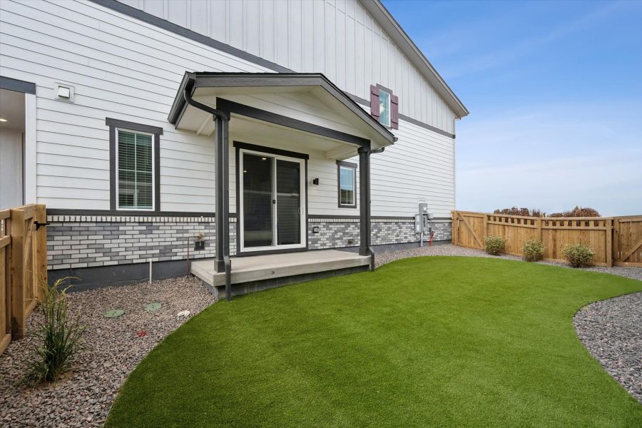 A house with a green lawn.