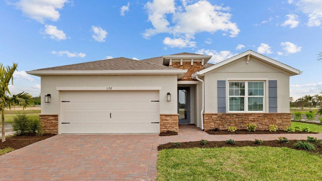 Front exterior of a home in the Cove at West Port - Tradition community, located in Port Charlotte, FL (Image 3).