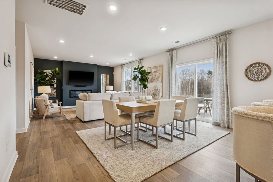 A dining room with a large window. A dining room with a large window.