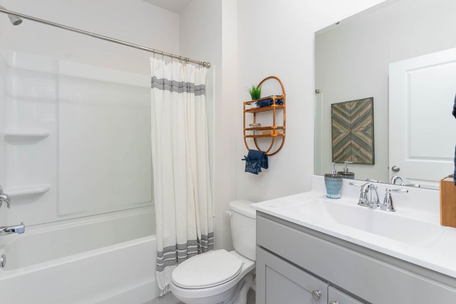 Furnished interior in a model home at Island Green in Myrtle Beach (Image 34).