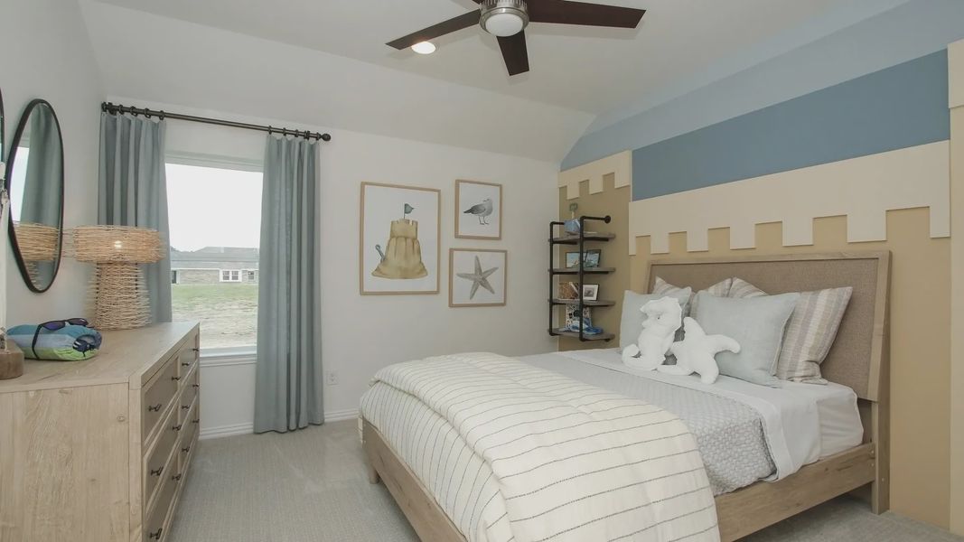 Elegant bedroom in Ellis Cove, featuring a unique castle-themed accent wall and sleek modern fan for luxury ambiance. Elegant bedroom in Ellis Cove, featuring a unique castle-themed accent wall and sleek modern fan for luxury ambiance.
