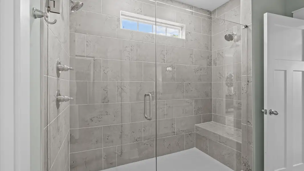 Superior en-suite primary bathroom with a stylish walk-in shower—crafted with high standards in mind in Fountain Inn, SC Superior en-suite primary bathroom with a stylish walk-in shower—crafted with high standards in mind in Fountain Inn, SC