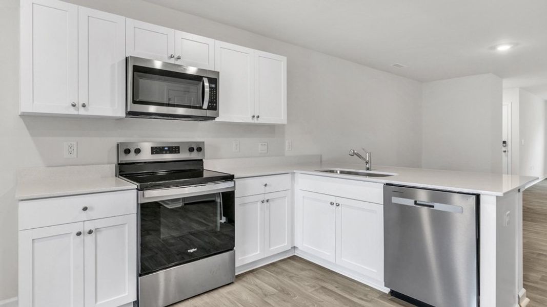 Furnished interior in a model home at The Townes at Wilson's Ridge in Wilson's Mills (Image 11).