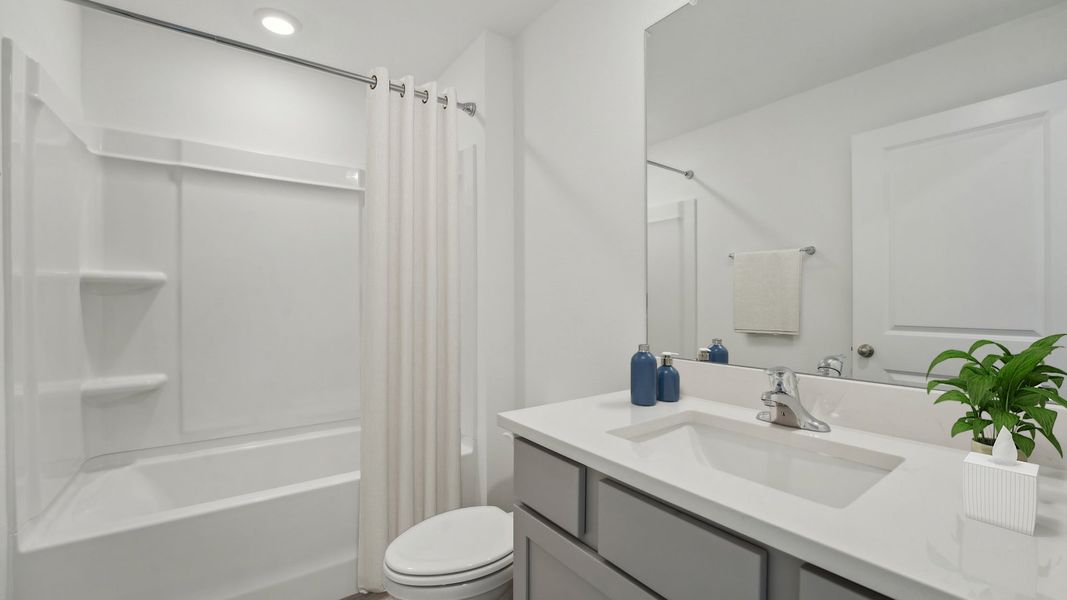 Furnished interior in a model home at Waterstone in Tampa (Image 10).