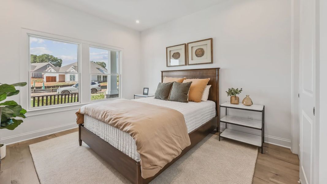 Furnished interior in a model home at The Courtyards at Post Road in Cumming (Image 16).