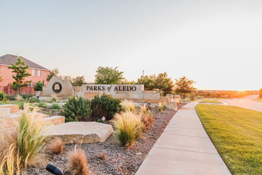 Entrance to the Parks of Aledo / Point Vista community in Aledo, TX, featuring signage and landscaping (Image 1). Entrance to the Parks of Aledo / Point Vista community in Aledo, TX, featuring signage and landscaping (Image 1).