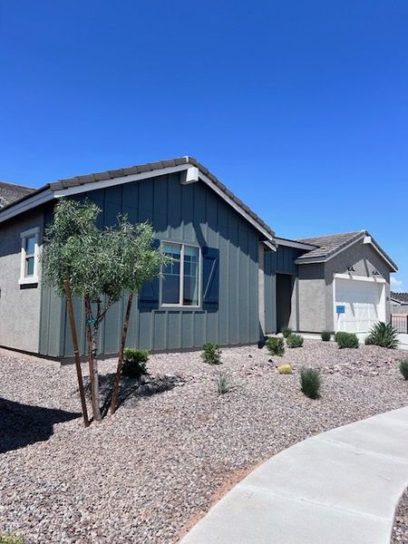 A modern single-story home with charming landscaping in Estates at Rancho Mirage by K. Hovnanian® Homes (Maricopa, AZ). A modern single-story home with charming landscaping in Estates at Rancho Mirage by K. Hovnanian® Homes (Maricopa, AZ).