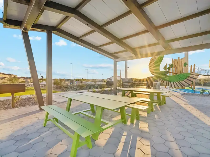 A picnic table under a covered area. A picnic table under a covered area.