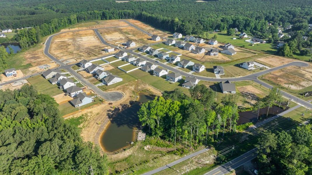 Aerial view of the Eagle Creek community in Fuquay Varina, NC, showing layout and nearby surroundings (Image 11). Aerial view of the Eagle Creek community in Fuquay Varina, NC, showing layout and nearby surroundings (Image 11).