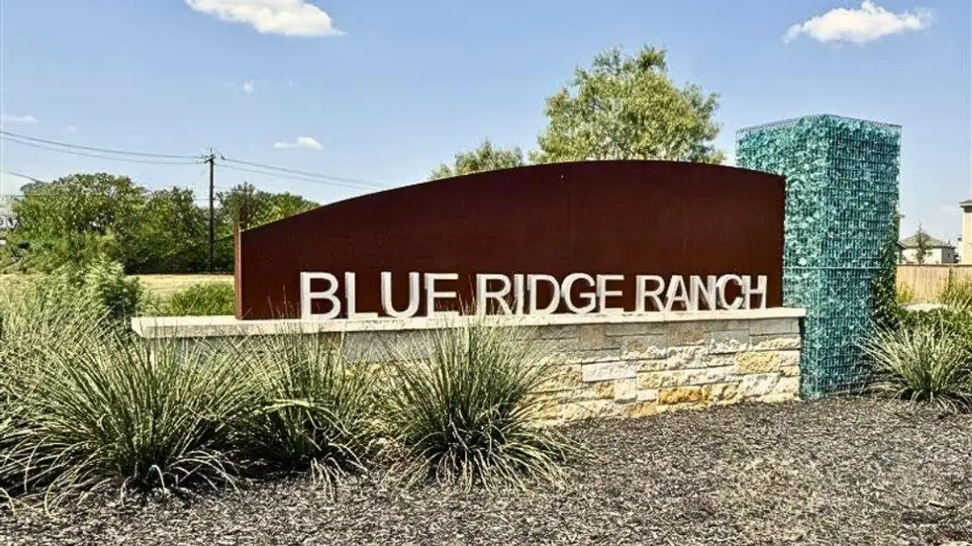 Entrance to the Blue Ridge Ranch community in San Antonio, TX, featuring signage and landscaping (Image 1).