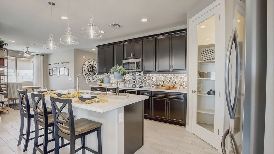 Furnished interior in a model home at Castillo at Anderson Parc in Buckeye (Image 3).