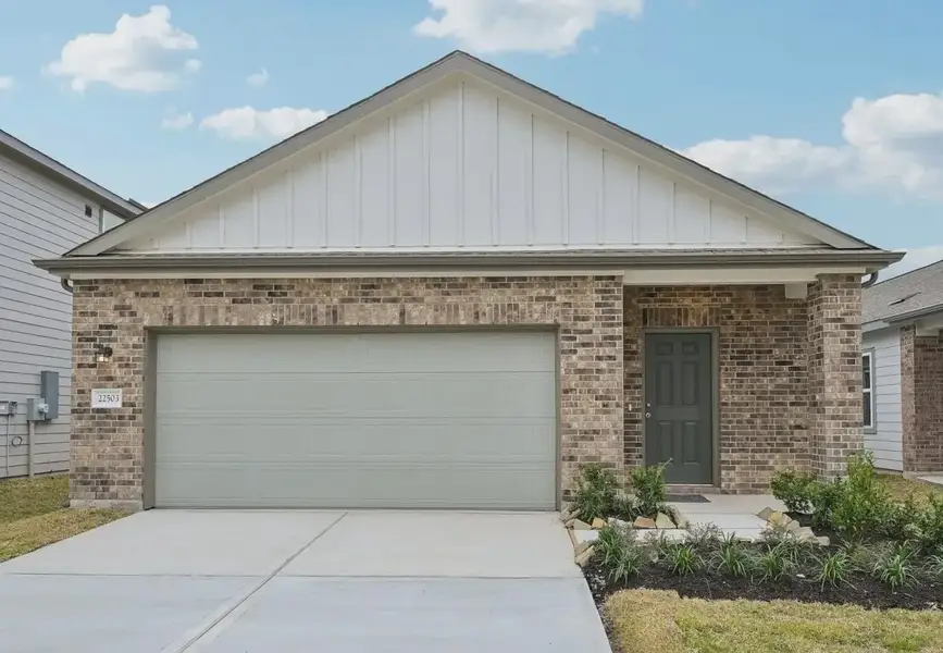 Front exterior of a home in the The Landing community, located in New Caney, TX (Image 3).